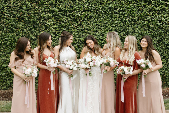 bride with bridesmaids in burgundy gold colors