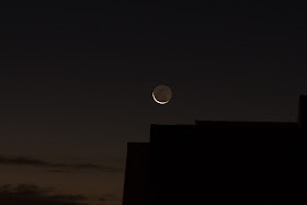 earthshine moon over roof