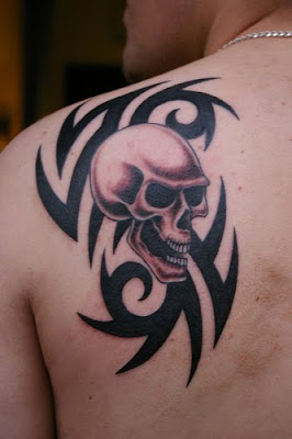 tribal skull tattoo, back upper tattoo ,skull tattoo, back upper tattoo