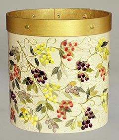 round wastebasket with grapevine motif