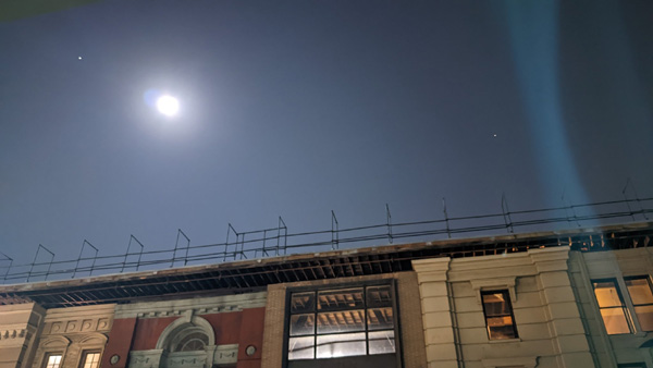 Jupiter, the Moon and Saturn are visible above a New York Street facade at the Warner Bros. studio backlot in Burbank, California...on October 7, 2022.