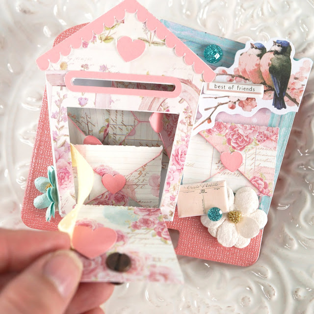 Heidi Swapp Memorydex Valentine's advent calendar made using the Prima With Love collection by Frank Garcia; love letters and birdhouse shaped mailbox die cuts decorated with ephemera, puffy stickers, paper flowers and jewels