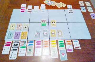 An image of Monopoly Deal game in play