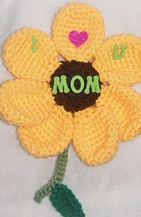 http://www.ravelry.com/patterns/library/free-pattern--mothers-day-magnet-a-crochet-pattern