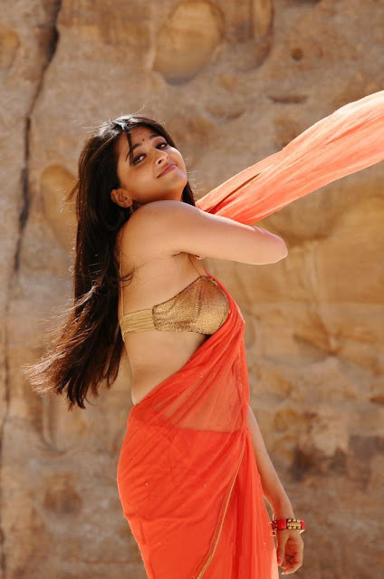 Anushka Shetty in Orange Saree - A stunning display of elegance and beauty