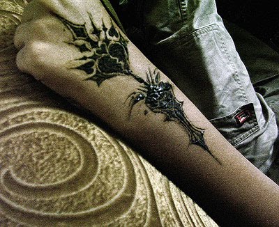 convention symbolizes that sub-culture more than the Gothic tattoo.