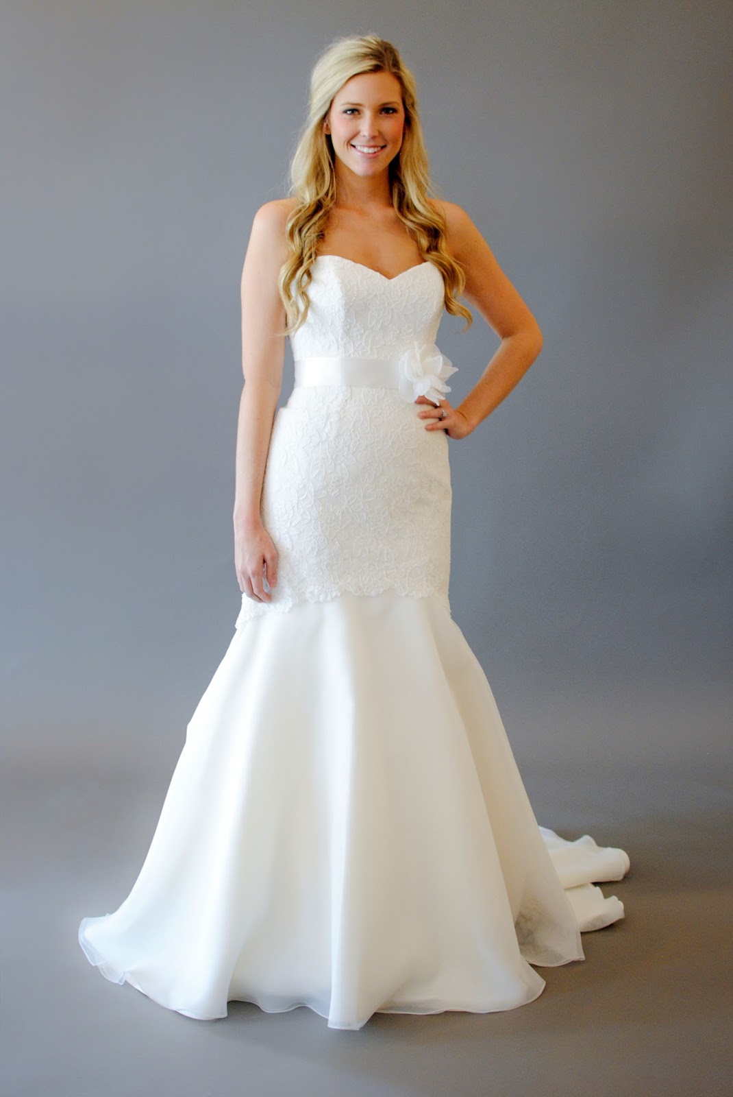 lace wedding dress with keyhole back  Lace gown with dramatic V back andsatin sash. The back is to die for