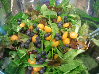 Blueberries and yellow tomato salad with fresh greens!