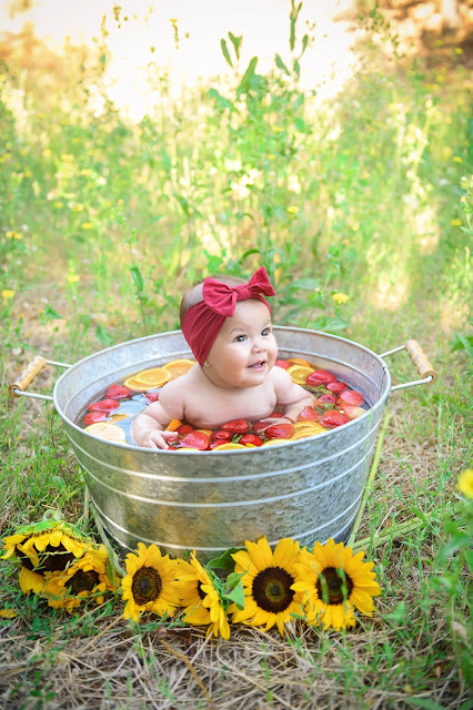 Little girl in fruit bath