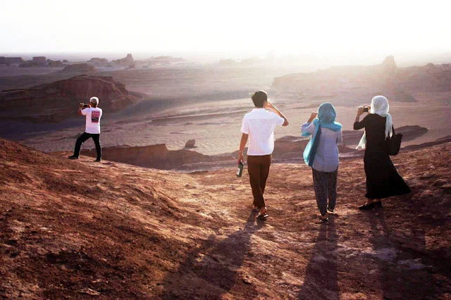 Travelers visiting Shahdad desert. Kerman-Iran