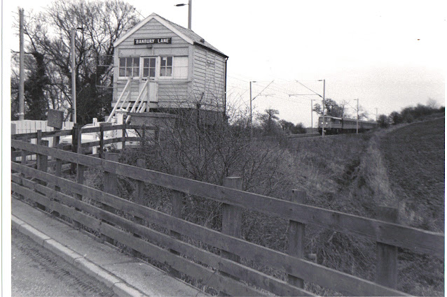 a photo of banbury lane signal box and approaching class 86 loco 1988