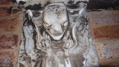 Carven image of a demon found on the islet Cemetario in the Venetian lagoon.