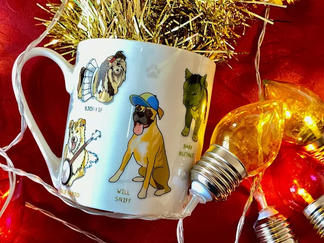 A mug with dogs with props and names like Will Sniff