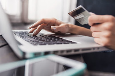 Ecommerce shop payment option with a credit card, a computer and a smartphone.