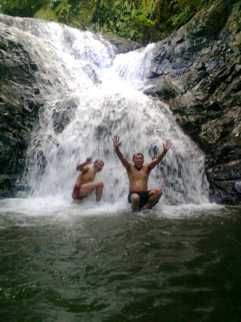 Enjoying the clear cool water of the falls