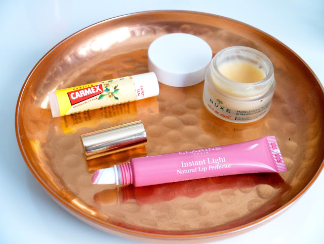 Clarins Instant Light Natural Lip Perfector, carmex and Nuxe reve de miel
