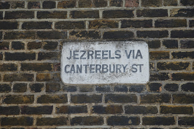 A similar sign saying 'JEZREELS VIA CANTERBURY STREET'