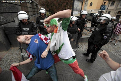 A Croatian And Irish Fans Joke In Front Of Polish Policemen In Poznan During Euro 2012 Match Between Croatia And Ireland