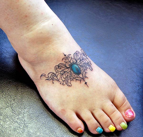 This is a beautiful and trendy small pattern tattoo design on the feet that give girl a nice look.