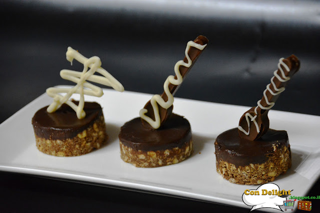 individual petit four dessert with chocolate decorations