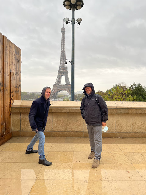 picture of two people in front of the Eiffel Tower