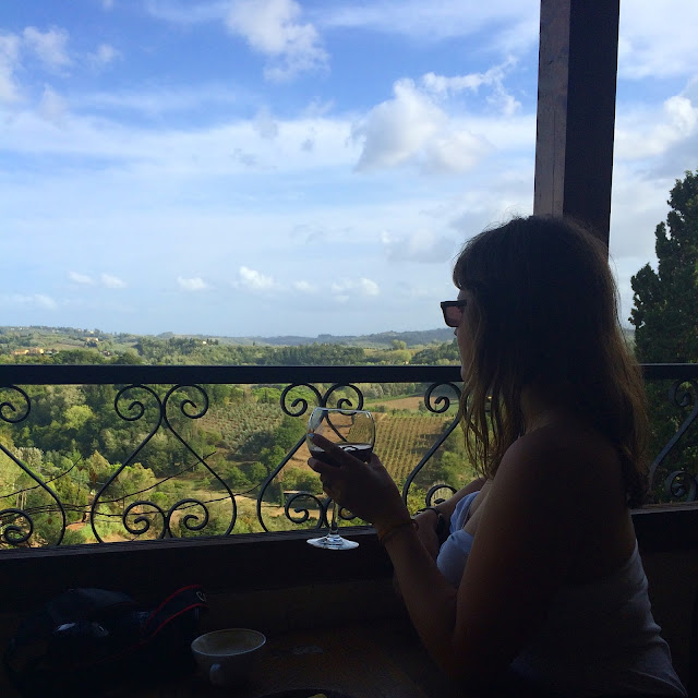 Katy drinking Chianti Red Wine on Balcony at Caffe Centrale San Miniato Tuscany Italy