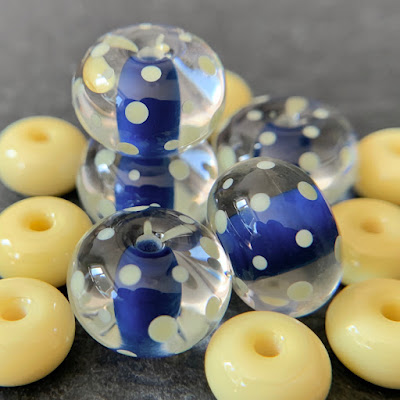 Handmade lampwork glass beads by Laura Sparling made with CiM Montezuma and CiM Ra