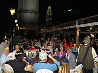 Guests having their dinner with the Petronas Twin Towers behind