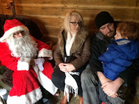 Mummy, Daddy and son talking to Santa