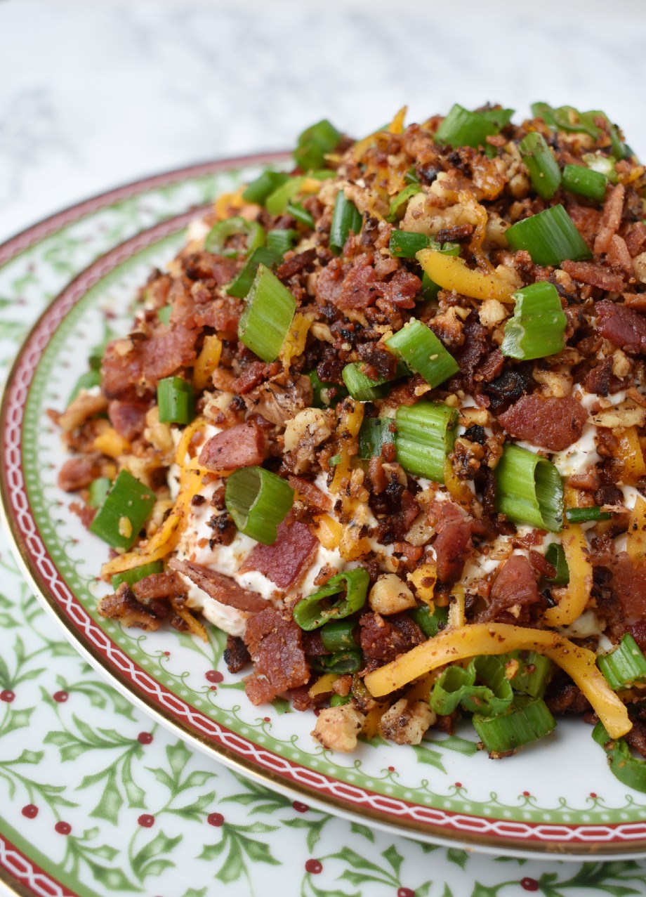 Bacon Walnut Cheese Ball features a cheese ball made with sharp cheddar cheese, fresh green onion, crispy bacon and bacon toasted walnuts. Served with garlic crostini for an indulgent, creamy and rich dip! #bacon #appetizer #cheeseball #cheese #holidays