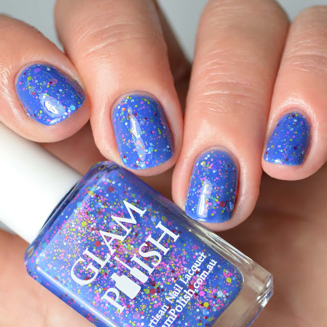 blue nail polish with glitter four finger swatch