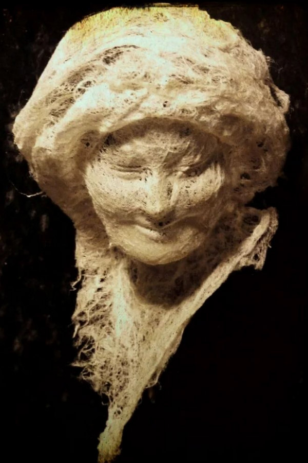 paper sculpture head of smiling woman