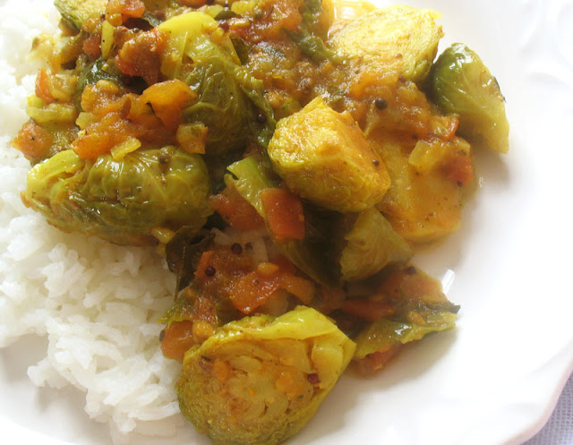 curried brussels in a spicy tomato sauce