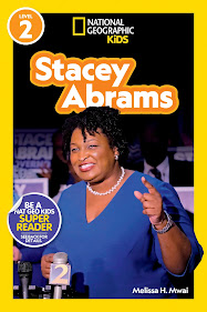 Book cover features a photo of Stacey Abrams standing behind several media microphones. She has a smile on her face and is holding up one hand and pointing up.