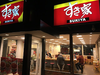 A picture outside looking in the popular beef-bowl chain "Sukiya"