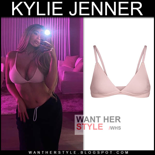 Kylie Jenner in pink bra and black sweatpants
