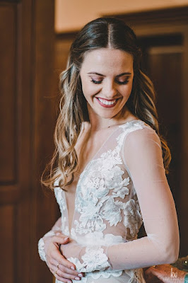 bride in lace wedding dress smiling