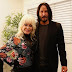 The interesting way Keanu Reeves takes photos with women