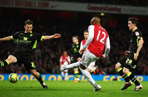 Thierry Henry shoots to score the winner for Arsenal against Leeds in the FA Cup