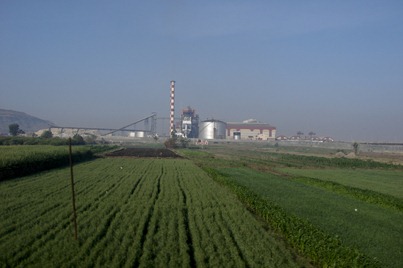 In-Dust-Realisation : Poverty and Pain compel farmers to fall for the mouthwatering eye wash and sell farmland to build polluting factories such as this : one day we dont have to hoard onions to increase prices, they just wont be there