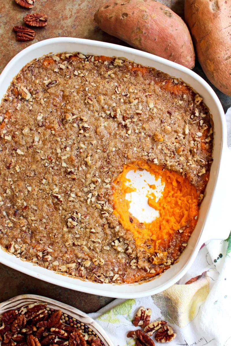 Brown Sugar Pecan Sweet Potato Casserole is made with creamy mashed sweet potatoes and an irresistible brown sugar pecan topping.  It is a holiday-worthy side dish that you will want to make year after year! #sidedishrecipe #sweetpotatoes #casserole