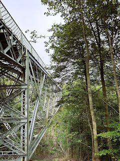 Another view showing one side of the iron viaduct crossing over to the other bank.  Trees grow on the right-hand side. Photo by Kevin Nosferatu for the Skulferatu Project.