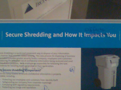 A poster on secure shredding with handwritten corrections