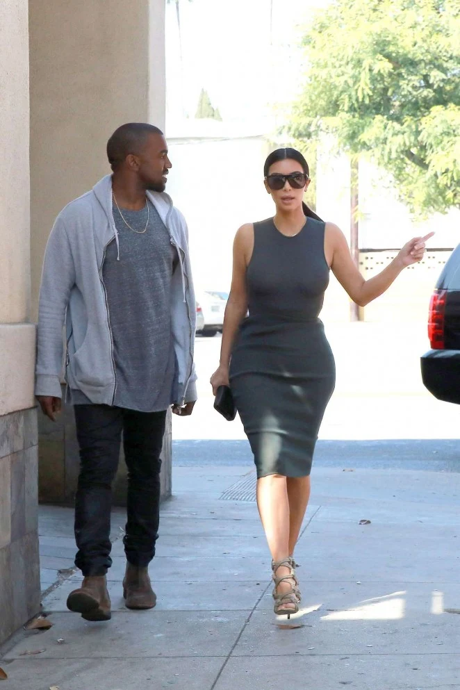 Kim Kardashian goes braless in a clingy dress in LA