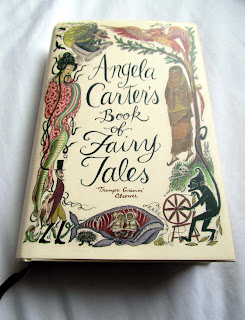 pretty, book covers, beautiful, awesome, good, paperback, hardback, photograph, illustrations, stack, pile of books, spines, appreciate, Angela Carter, fairy tales, stories, folk, snake woman, wale, oral history, classic, spinning wheel 