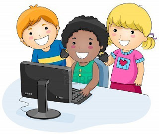 a small group of children using a computer