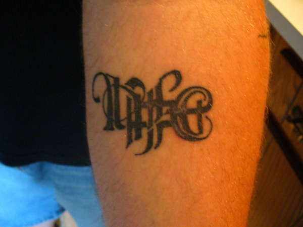 Small ambigram tattoo artwork.