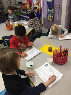 Picture five of students doing an erosion experiment