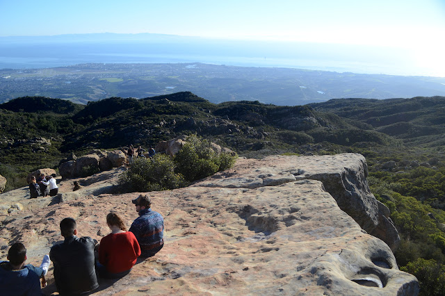 crowds scattered through the rocks