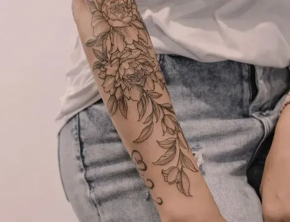 A flower tattoo on a girl's arm